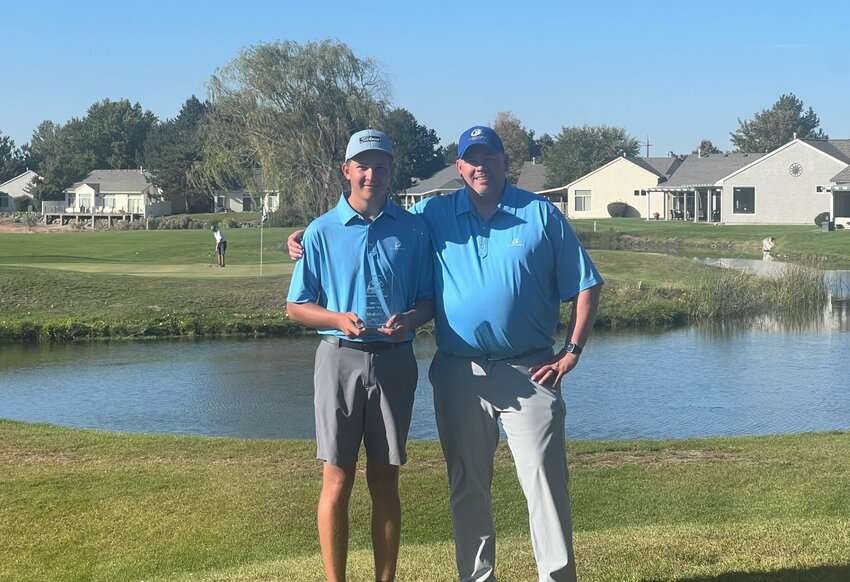 Luke Fenner (left) holds trophy after winning the CBC League Match tournament, accompanied by Head Coach Russell Olsen. 