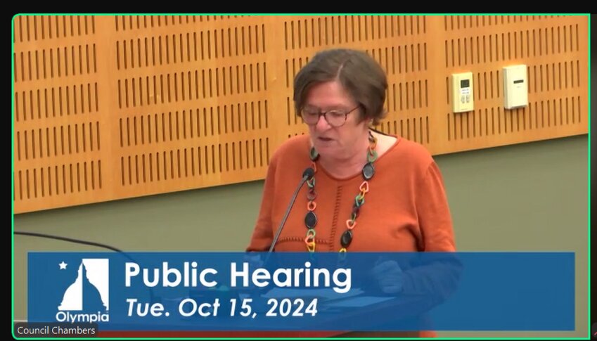 Olympia community member Yonah Mikowski comments against Initiative 2109 during a public hearing at the city council meeting on Tuesday, Oct. 15, 2024. 