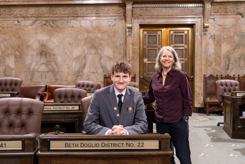 Page Aleksander Bielawski with Rep. Beth Doglio (D-Olympia) on Feb. 7, 2025.