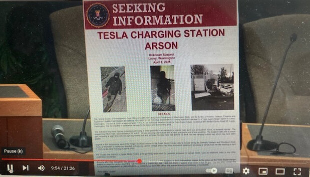 A seeking information poster shows the man wanted in connection with an incident that damages a Tesla charging station in Lacey on Tuesday, April 8, 2025.