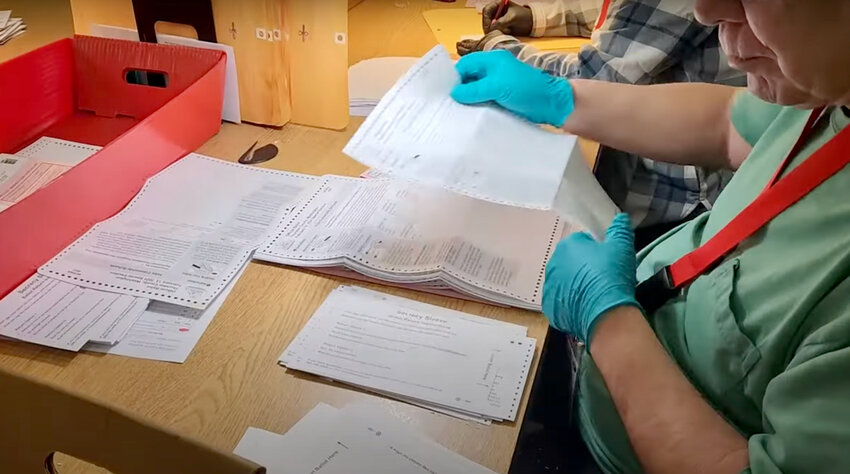 A Thurston County employee prepared ballots for processing, as seen in a frame from the &quot;Your Neighbors, Your Elections&quot; video series, which recently garnered national recognition for its behind-the-scenes look at the county&rsquo;s elections operations.&nbsp;