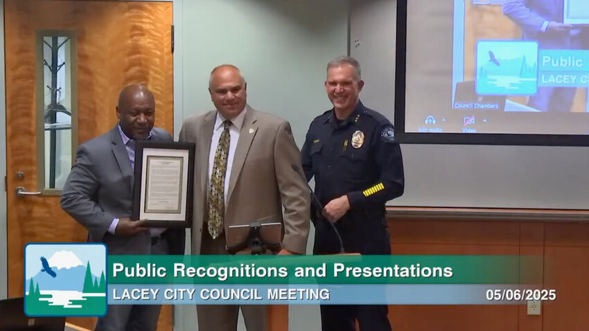 The Lacey City Council honored retiring Lacey Police Department Commander Jim Mack, center, on May 6, 2025, with a formal commendation recognizing his 35 years of dedicated service to the community.