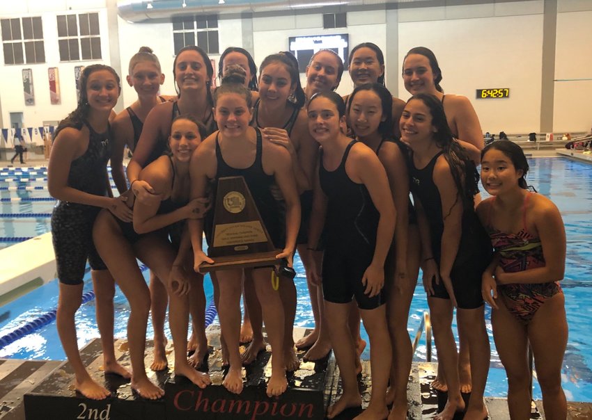 Taylor High&rsquo;s girls swimming team won its second straight Region V-6A championship, nipping Seven Lakes, on Saturday, Feb. 1, in Cypress.
