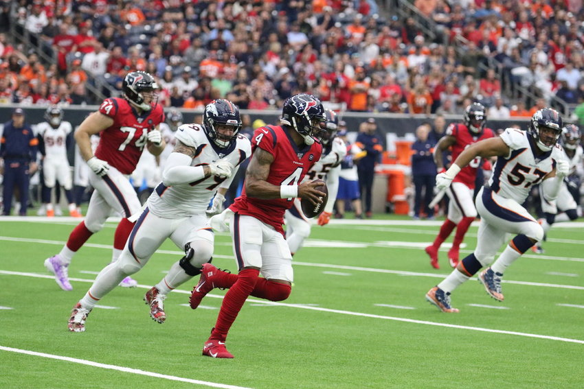 The Houston Texans' 2020 schedule was released Thursday night and features two primetime games, including a 2012 Thanksgiving rematch against the Detroit Lions. Pictured is Houston quarterback Deshaun Watson avoiding the Denver Broncos' defense in a non-conference game at NRG Stadium on Dec. 8. Denver won, 38-24.