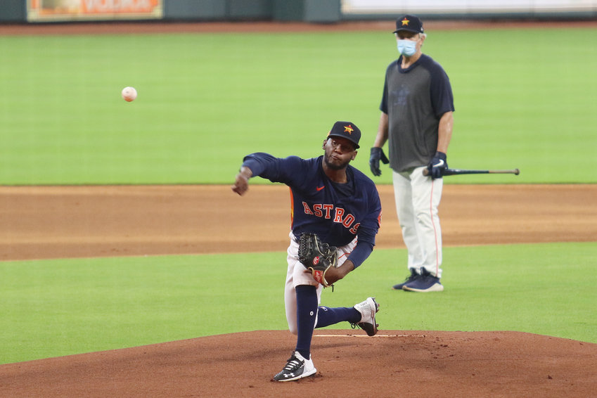Houston Astros pitcher Enoli Paredes unleashes a pitch during batting practice at Minute Maid Park Sunday afternoon.