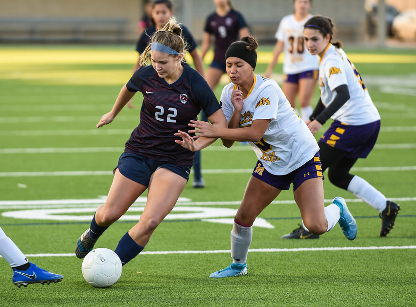 Skylar Parker finished her high school soccer career without being able to finish the postseason due to COVID-19 but landed on TopDrawerSoccer&rsquo;s all-region team for scoring 20 goals and eight assists to help the Lady Falcons finish atop the District 19-6A standings in a shortened regular season. Pictured is Parker in a battle against McAllen during the I-10 Soccer Shootout at Legacy Stadium in Katy this last January.