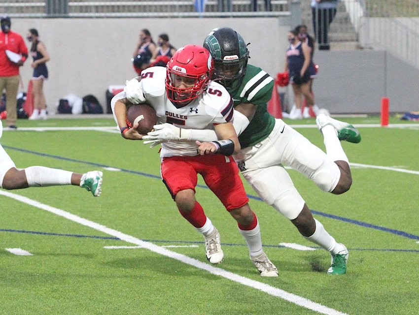 Mayde Creek defensive lineman Gregory Meeks II chases down Dulles quarterback Ryan Alaniz for a sack in a non-district game against the Vikings at Legacy Stadium in Katy on Oct. 8, 2020.
