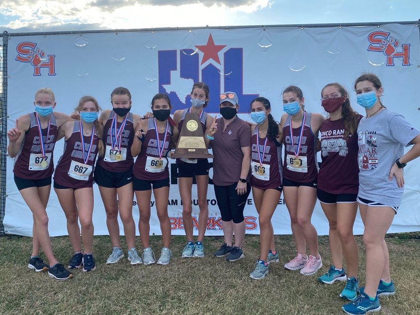 Cinco Ranch&rsquo;s girls won the Region III-6A cross country team championship on Tuesday afternoon in Huntsville. Senior Sophie Atkinson, holding the team regional championship trophy, finished first.
