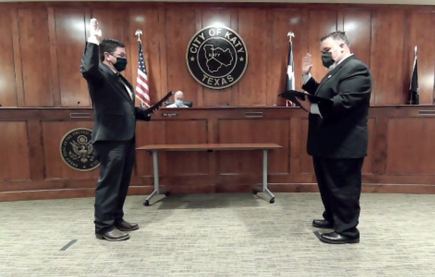 Newly-elected Ward B Katy City Council Member Rory Robertson is sworn in by City of Katy Municipal Court Judge Jeffrey Brashear during the semi-virtual Katy City Council meeting held Nov. 17. Incumbent council members Chris Harris and Janet Corte were sworn in during separate ceremonies earlier in the day in order to limit the number of people in council chambers due to COVID-19 concerns.