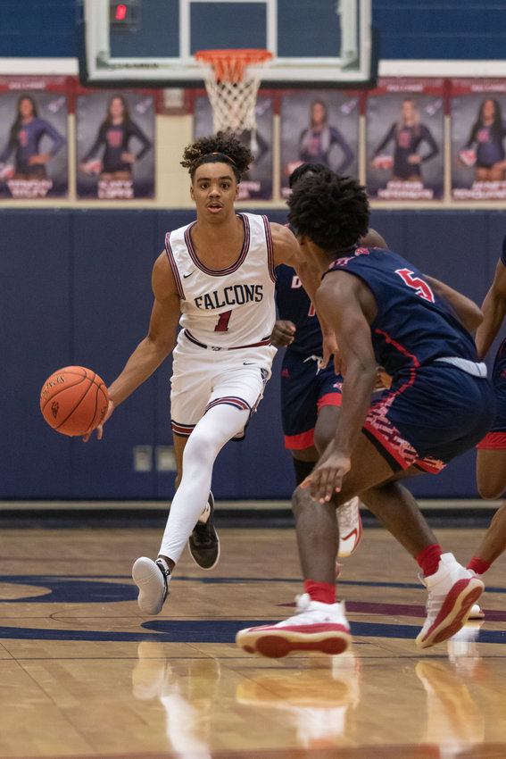 Tompkins guard B.B. Knight II dribbles upcourt during a game against Aldine Davis on Nov. 17 at Tompkins High.