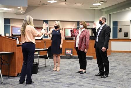 Ashley Vann (left), Leah Wilson (center) and Greg Schulte (far right) are sworn into office after winning their respective KISD Board of Trustees seats Nov. 3.
