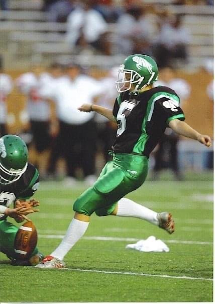 Amanda Taylor, formerly Amanda DeLafosse, is shown kicking for Mayde Creek in a varsity football game during the 2006 season. Taylor is the first Katy ISD female football player to score points in a varsity game.