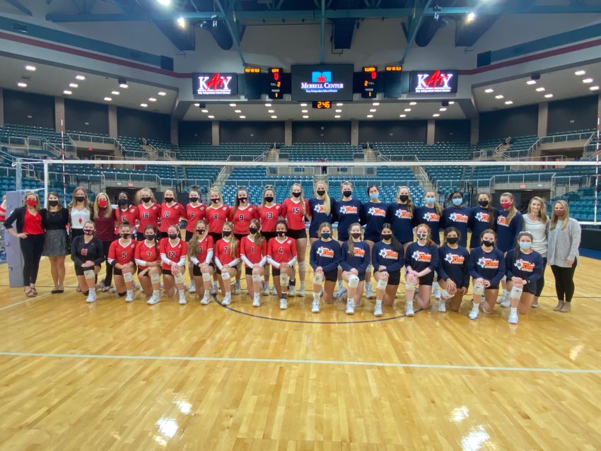 Katy High and Seven Lakes players and coaches posed for a photo before their Class 6A Region III volleyball final at the Merrell Center on Dec. 4. It was the first all-Katy ISD regional final in volleyball.