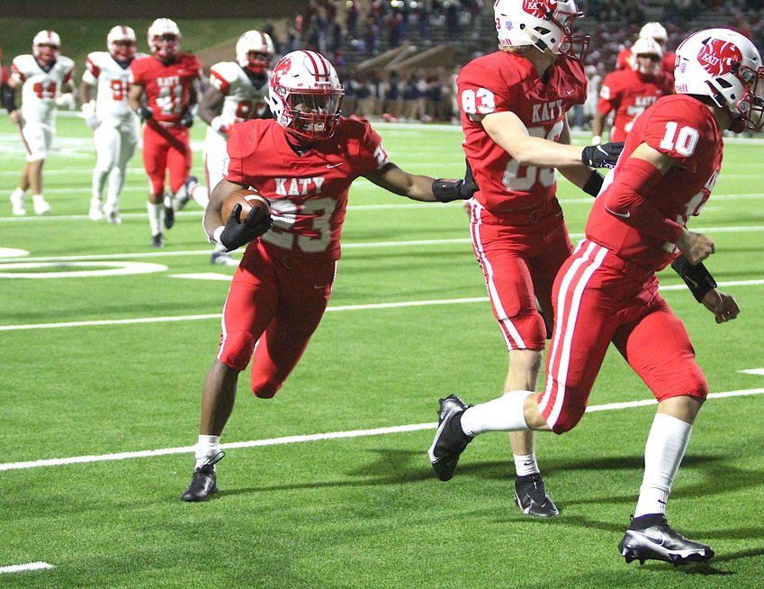 Katy sophomore running back Seth Davis runs for one of his two touchdowns during Katy's 6A D2 area playoff win over Lamar at Rhodes Stadium last season.