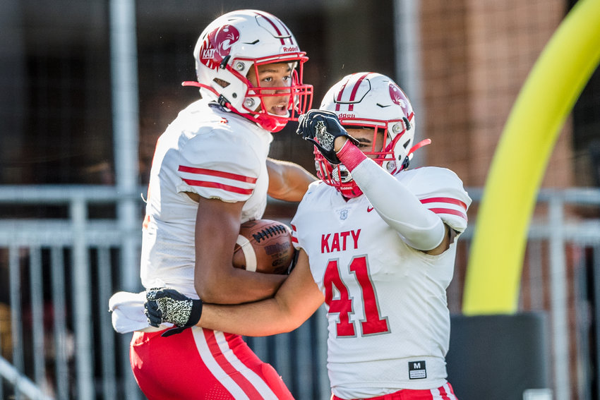 Katy&rsquo;s Nicholas Anderson (4), left, celebrates his touchdown reception with teammate Emilio Silva (41) during Saturday&rsquo;s 49-24 win over Shadow Creek in the Region III 6A Division 2 semifinal at Freedom Field in Iowa Colony.