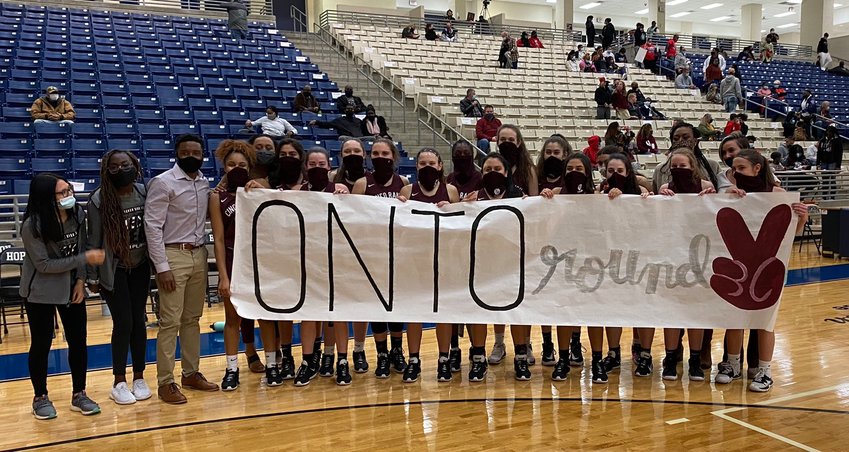 Cinco Ranch's girls team celebrated their bi-district playoff win over George Ranch on Thursday at Hopson Field House in Missouri City.