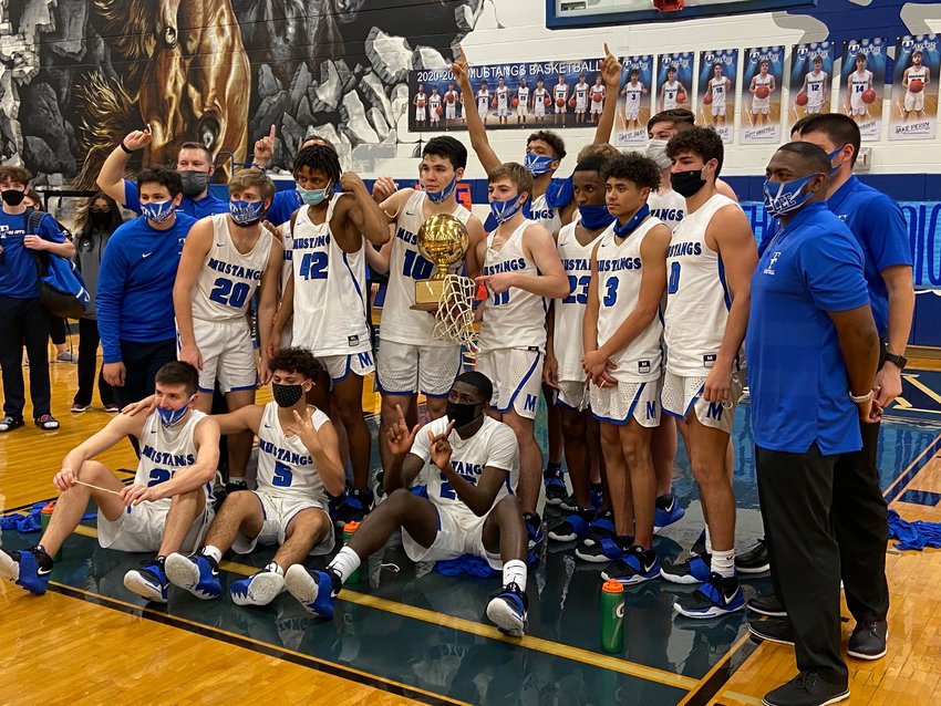 Taylor's boys basketball team fell short of its goal of making it to the third round of the playoffs for the first time in program history, but the Mustangs did accomplish their other two goals of making the playoffs and winning a district championship for the first time since 1995.
