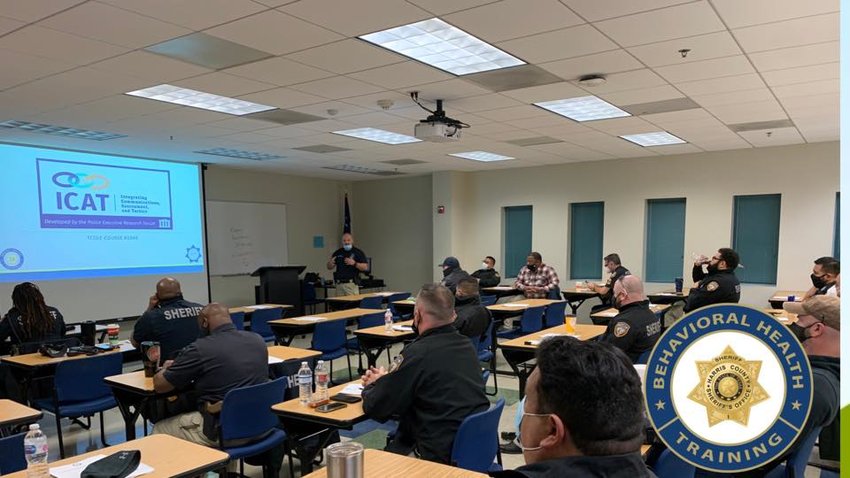 Part of the HCSO Mental Health and Jail Diversion program is intensified de-escalation and training for deputies &ndash; both regular street deputies and MHJD deputies &ndash; as well as command staff to participate in increased mental health and de-escalation trainings such as the one shown here in this picture. For more information, readers are encouraged to visit www.theharriscenter.org.