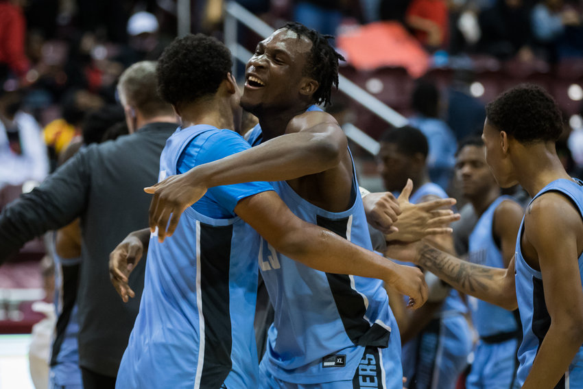 Paetow&rsquo;s Everett Marlatt (22), left, and Charles Chukwu (23) celebrate the Panthers&rsquo; victory over Goose Creek Memorial in Tuesday&rsquo;s Class 5A Region III semifinals at the Campbell Center in Houston.