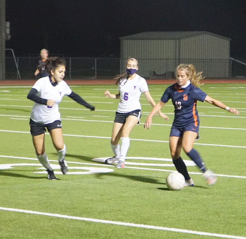 Seven Lakes senior Phoebe Harpole (13) controls possession during the Spartans&rsquo; 7-0 win over Morton Ranch on Tuesday, March 9, at Seven Lakes High.