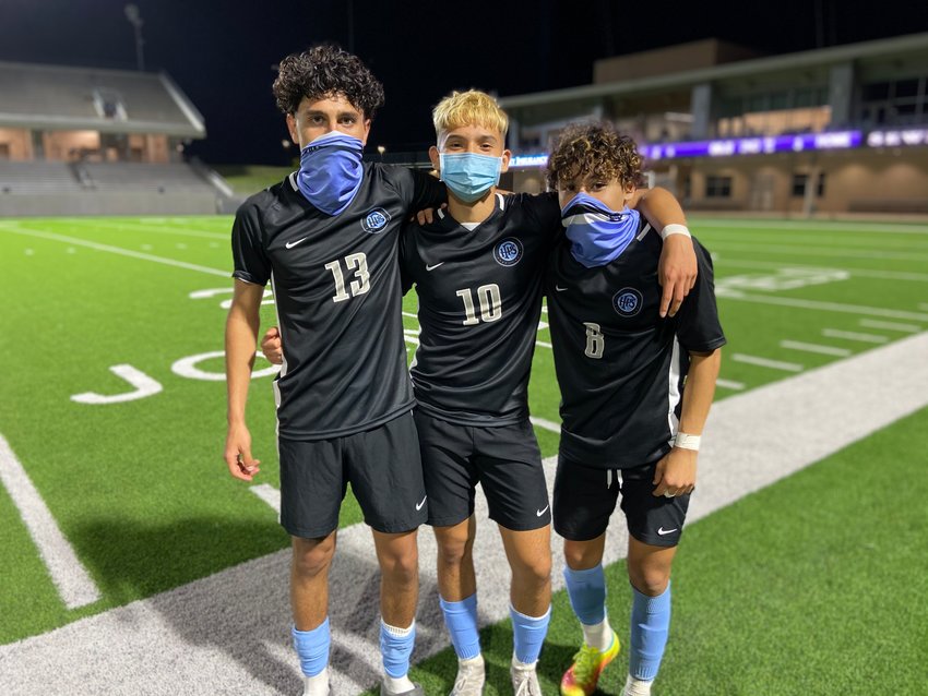 From left to right, Paetow junior Dominic Posada, senior Hessler Magana and junior Lukas Herrera pose for a photo after scoring goals in the Panthers&rsquo; 3-2 Class 5A bi-district playoff win over New Caney on Thursday, March 25, at Legacy Stadium.