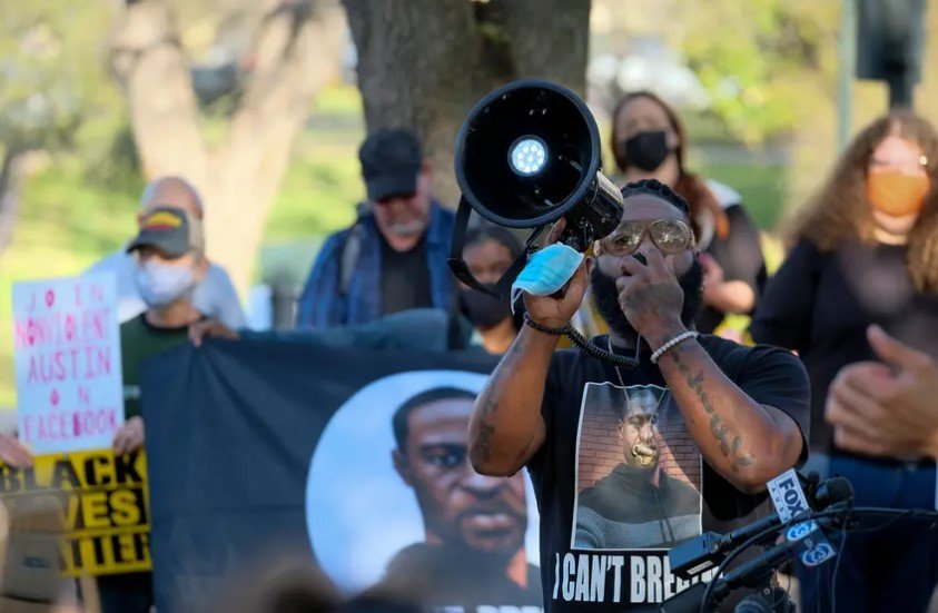 Activist and author Cluren Williams led a chant at a rally to support the Texas George Floyd Act outside the Texas Capitol before the bill's hearing Thursday.