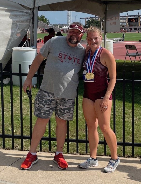 Cinco Ranch senior thrower Amelia Flynt is pictured with her father Darren after winning gold in the discus and shot put throws at the Class 6A state track and field meet Saturday, May 8, at Mike A. Myers Stadium at the University of Texas at Austin.