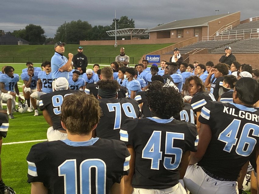 Paetow coach BJ Gotte talks to his players after their Blue-Black spring football game Tuesday, May 18, at Rhodes Stadium.