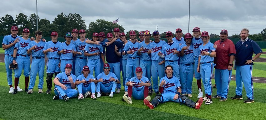 Tompkins baseball coaches and players pose for a photo in celebration of their Game 3 regional quarterfinal win over Cy-Fair on Saturday, May 22, at Tomball Memorial High School.
