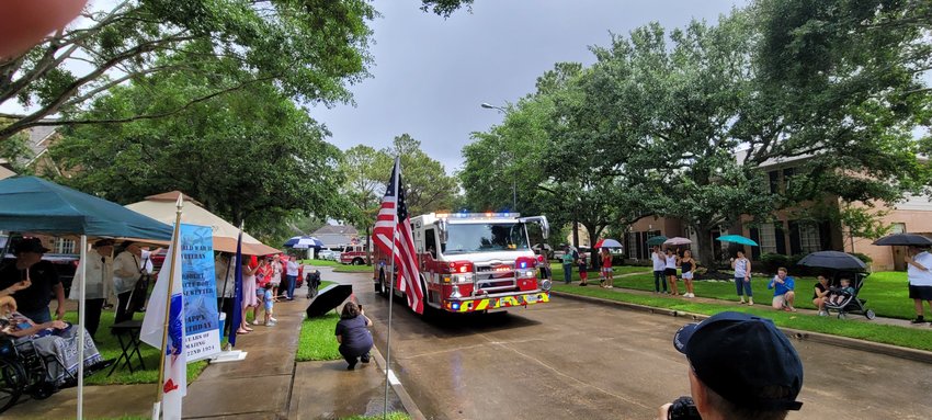 A Harris County Emergency Services District 48 fire truck with lights and siren going passes by Kiesewetter&rsquo;s home during the parade last Saturday. Many of Kiesewetter&rsquo;s neighbors joined veterans, a biker group and others to honor Kiesewetter.