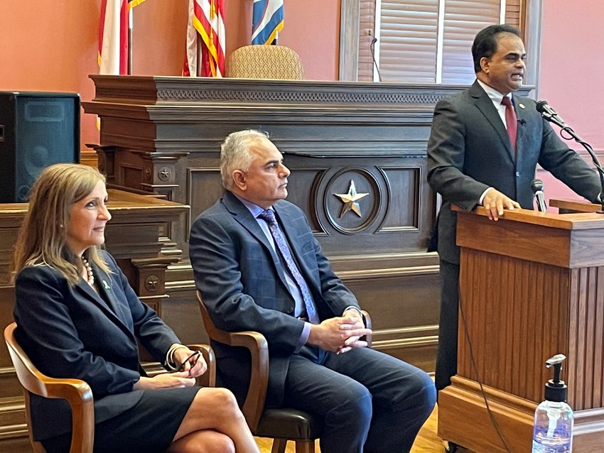 Fort Bend County Judge KP George (at podium) speaks at a May 28 gathering to honor Dr. Connie Almeida and Dr. Asim Shaw for their efforts in the field of mental health.