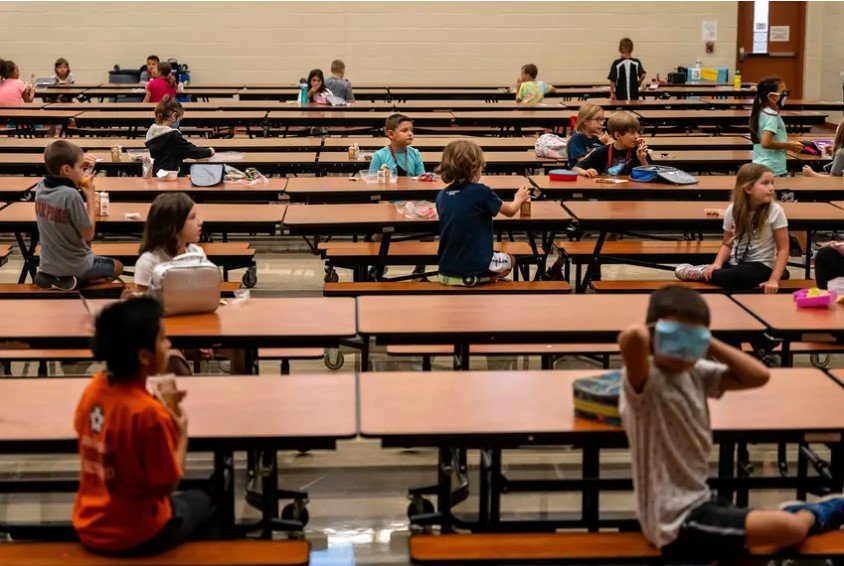 Students are socially distanced in the lunchroom at Jacob&rsquo;s Well Elementary School in Wimberley. The Texas Health and Human Services Commission will allocate around $2.5 billion in food benefits to all eligible families. School districts will notify families about eligibility by June 2.