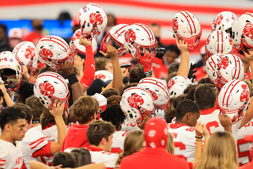 Katy players celebrate their 51-14 win over Cedar Hill at AT&amp;T Stadium on Jan. 16. Katy won the Class 6A-Division II state championship during the 2020-21 season. KHS Head Football Coach Gary Joseph hopes to continue with the Tigers&rsquo; winning streak when football starts up again this fall.