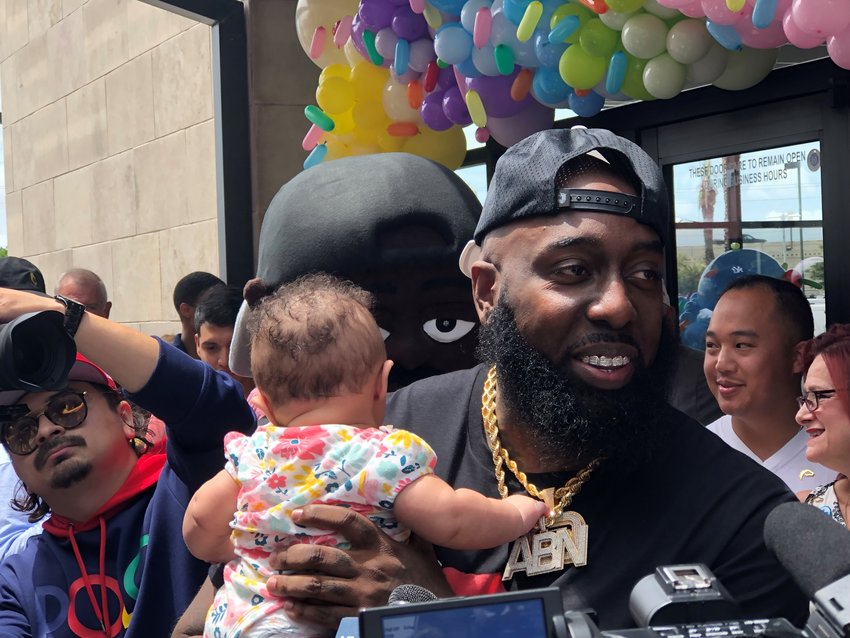 Houston rap artist Trae the Truth poses with a youngster, whose father told the rapper that the baby was named in Trae&rsquo;s honor.