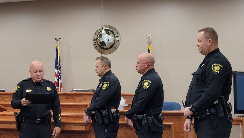 Fort Bend County Constable for Precinct 3 Chad Norvell (left) presents Life Saver awards to deputies (from left to right) Gregory Markovsky, Bryan Steffen and Roger Castillo on Wednesday, July 28 at the Fort Bend County Precinct 3 Annex.