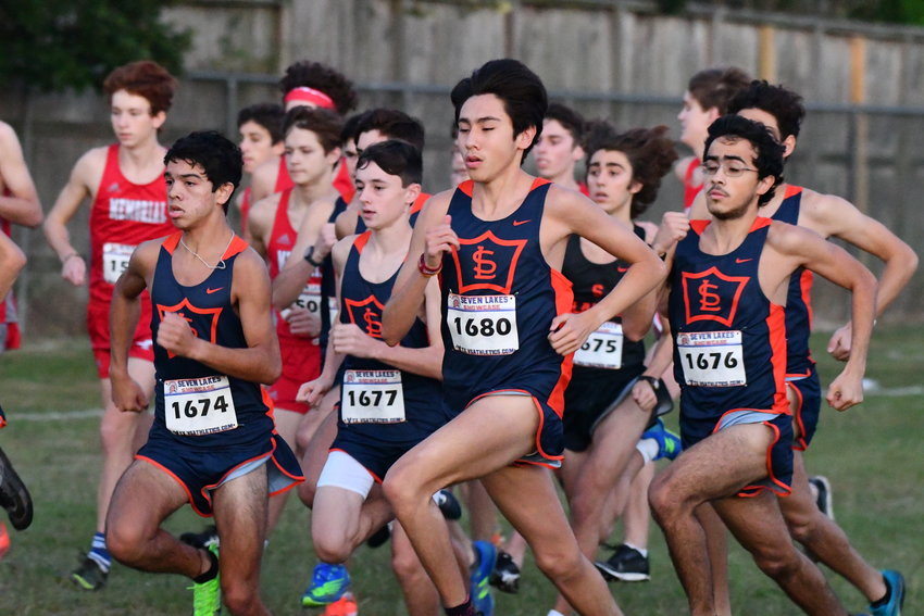 The boys cross country team at a meet. They are preparing to test their endurance on the track. Each member trains according to their strengths and weaknesses so that no member is left behind. Photo courtesy Scott Kenney