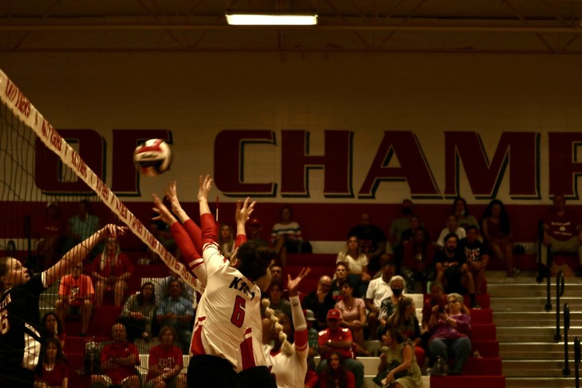 A number of Katy High players go up for a block attempt against Fort Bend Austin during Tuesday&rsquo;s match at the Katy High gym.