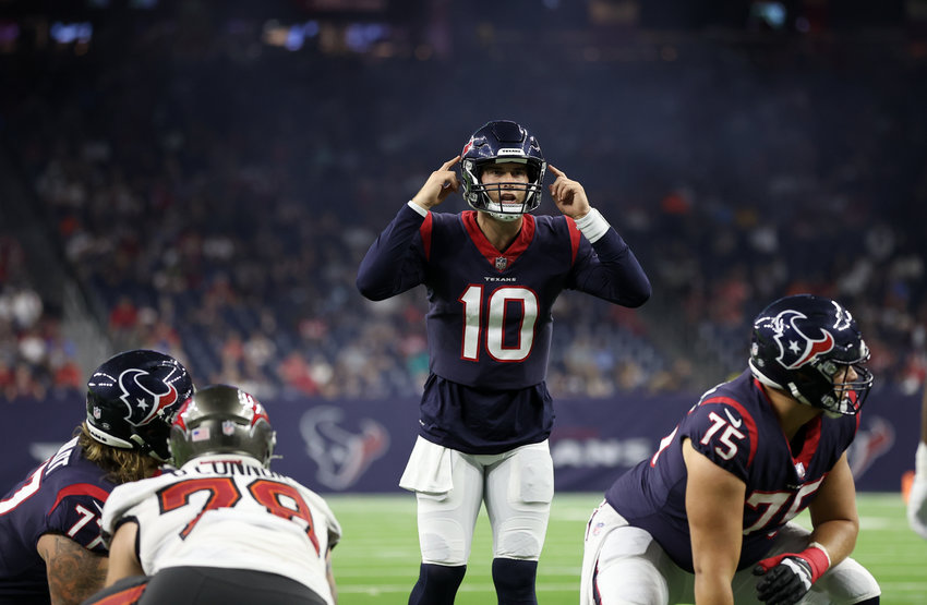 Houston Texans quarterback Davis Mills (10) prepares to take a snap during an NFL preseason game between the Houston Texans and the Tampa Bay Buccaneers on August 28, 2021 in Houston, Texas.