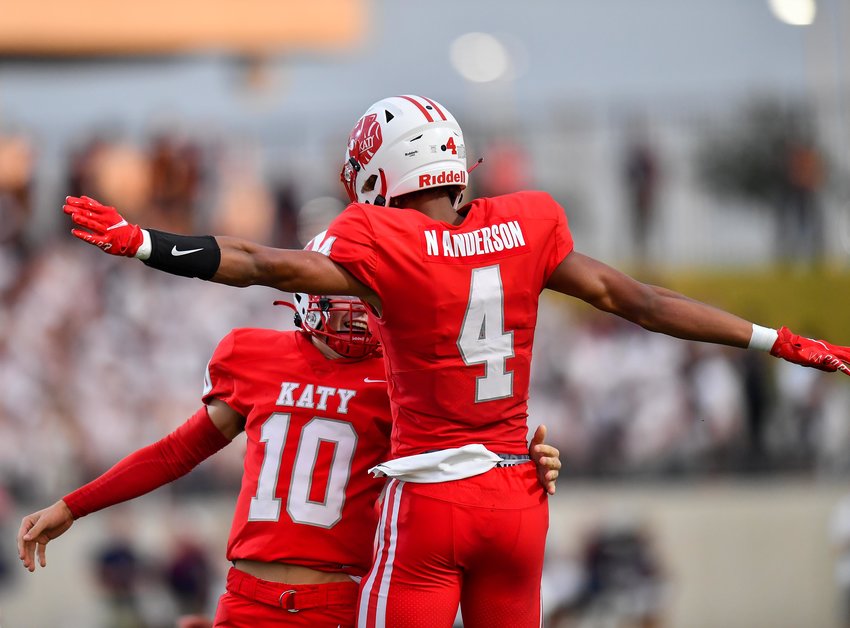 Katy, Tx. Oct. 1, 2021: Katy's #4 Nic Anderson and Katy's #10 Caleb Koger celebrate a TD during a game between Katy Tigers and Tompkins Falcons at Legacy Stadium in Katy. (Photo by Mark Goodman / Katy Times)