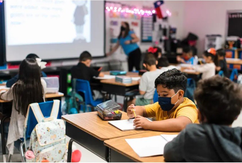 Students work at their desks at Blanco Vista Elementary School in San Marcos. Two months into this school year, districts have reported 172,275 cases in students statewide, but state data on school cases is incomplete and likely an undercount.
