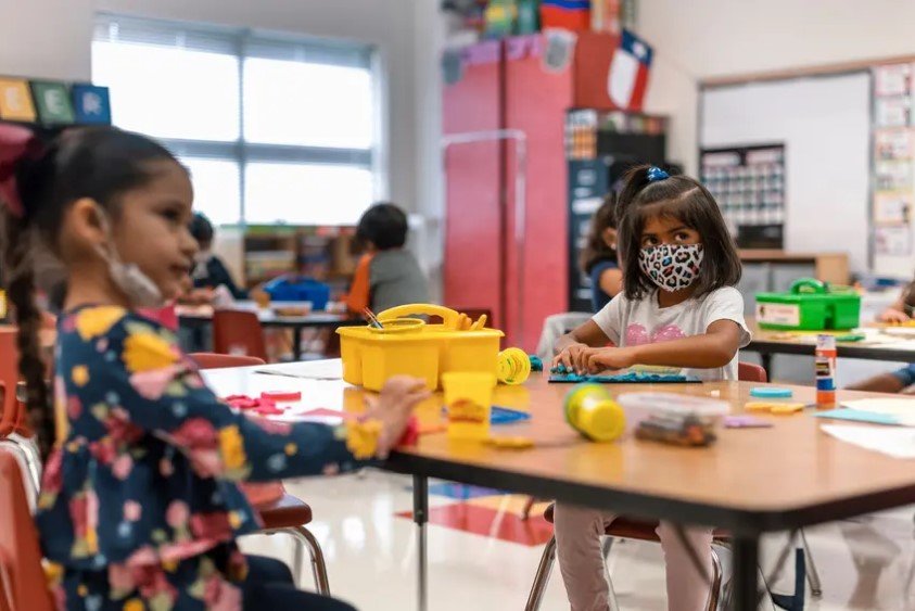 Kindergarten students work at their desks at Blanco Vista Elementary School in San Marcos. Plaintiffs say the governor&rsquo;s order denies children with disabilities, who are at a high risk of illness and death from the coronavirus, access to public education.