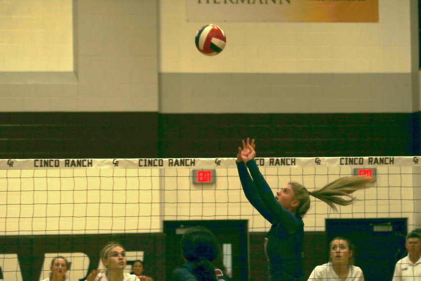 Tompkins Presley Powell sets a ball during a match against Cinco Ranch at the Cinco Ranch gym on Tuesday.