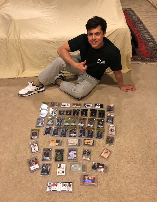Zachary Lynch poses with a portion of his own collection of collectible sports cards. Lynch is a finance student at Texas A&amp;M and has worked with two partners to form Card Stock Exchange, a website that tracks trading card value with a mindset that each card is a financial investment &ndash; not just a collectible.
