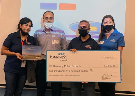 Harmony School of Innovation &ndash; Katy math teacher Nasim Chenari (far left) is awarded a check for $2,500 for her dedication to innovative education. She is joined by coworkers and staff from Marathon Oil which provided the grant award.