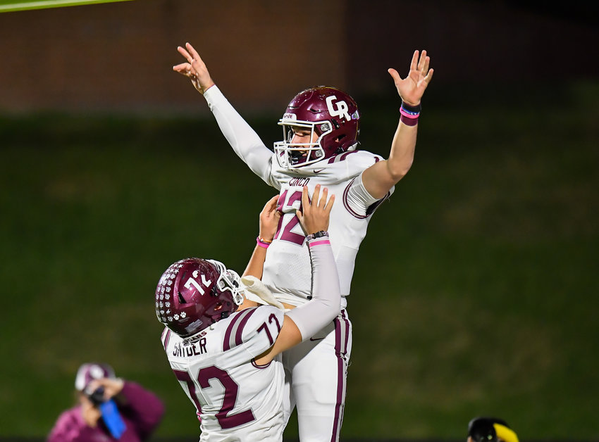 Katy, Tx. Oct. 29, 2021: Cinco Ranch's QB Gavin Rutherford #12 celebrates after scoring a TD with team mate Cinco Ranch's Cade Snyder #72 during a conference game between Cinco Ranch and Morton Ranch at Rhodes Stadium in Katy. (Photo by Mark Goodman / Katy Times)