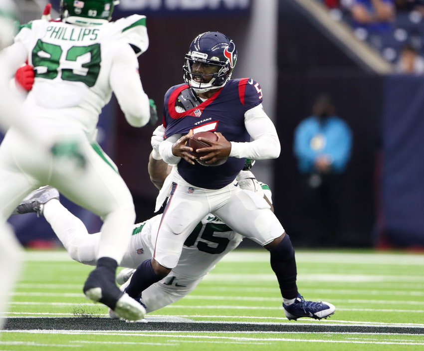 New York Jets defensive tackle Quinnen Williams (95) sacks Houston Texans quarterback Tyrod Taylor (5) during an NFL game between the Houston Texans and the New York Jets on November 28, 2021 in Houston, Texas. The Jets won, 21-14