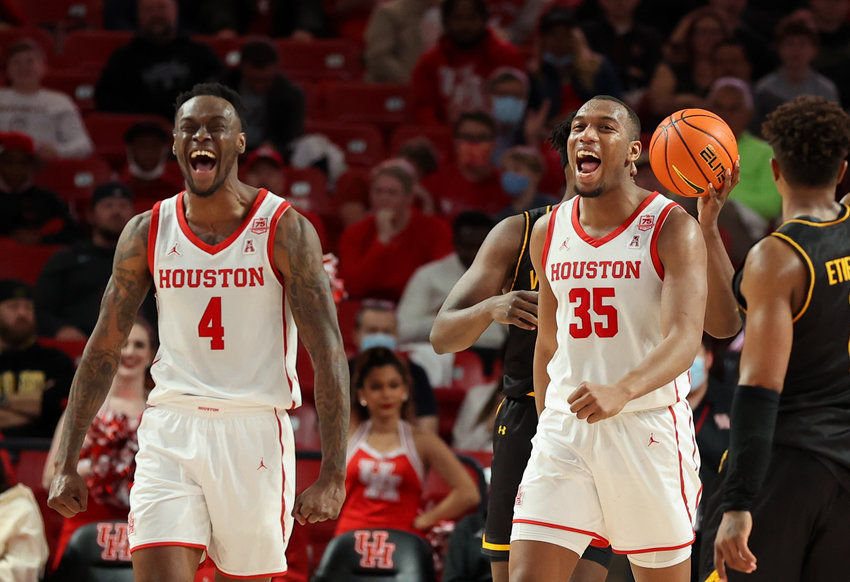 Houston Cougars guard Taze Moore (4) and forward Fabian White Jr. (35) react after blocking a shot during an NCAA men&rsquo;s basketball game between Houston and Wichita State on Jan. 8, 2022 in Houston, Texas.