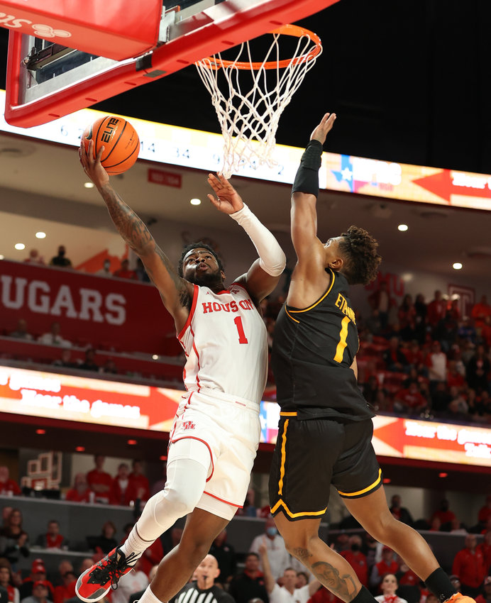 Houston Cougars guard Jamal Shead (1) goes to the basket against Wichita State Shockers guard Tyson Etienne (1) during an NCAA men&rsquo;s basketball game on Jan. 8, 2022 in Houston, Texas.