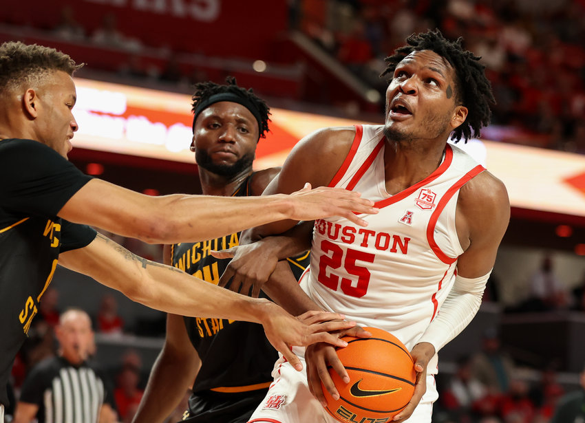 Houston Cougars center Josh Carlton (25) is fouled under the basket during an NCAA men&rsquo;s basketball game between Houston and Wichita State on Jan. 8, 2022 in Houston, Texas.