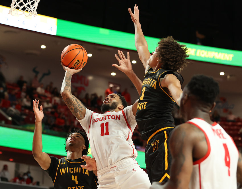 Houston Cougars guard Kyler Edwards (11) goes to the basket during an NCAA men&rsquo;s basketball game between Houston and Wichita State on Jan. 8, 2022 in Houston, Texas.